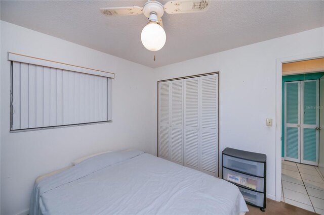 2113 Barksdale St, Port Charlotte, FL 33948 - bedroom with a closet, ceiling fan, and tile patterned floors