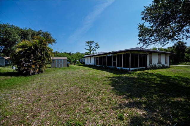 2113 Barksdale St, Port Charlotte, FL 33948 - view of green lawn featuring a sunroom