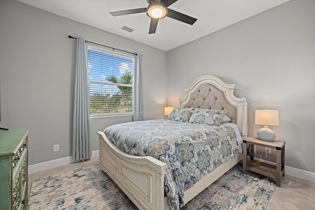 bedroom with visible vents, a ceiling fan, baseboards, and light tile patterned flooring