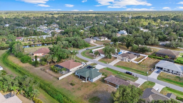aerial view with a wooded view and a residential view