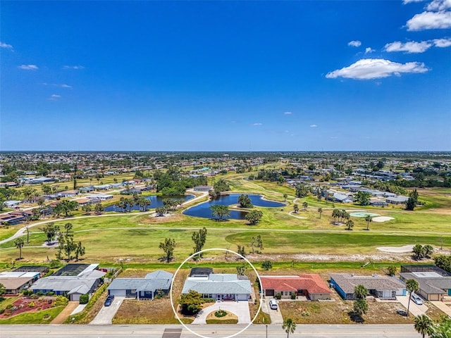 aerial view with a water view, a residential view, and golf course view