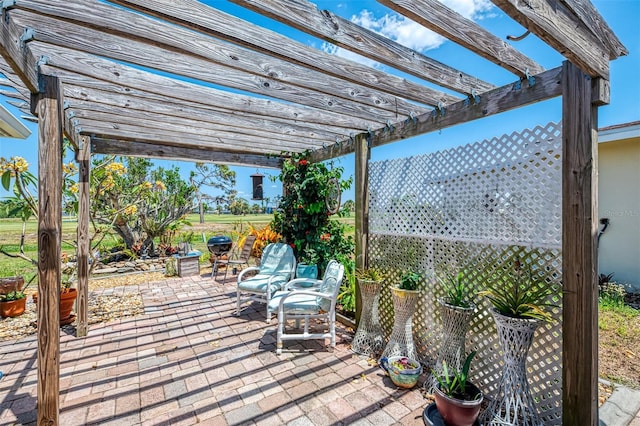 deck with a patio area and a pergola