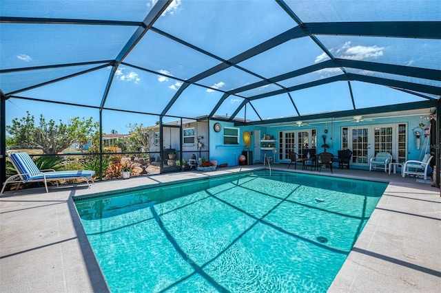outdoor pool featuring ceiling fan, a patio area, a lanai, and french doors