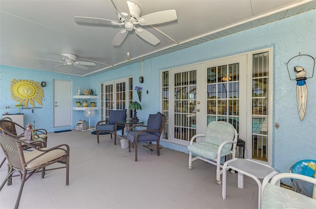 view of patio / terrace featuring a ceiling fan and french doors