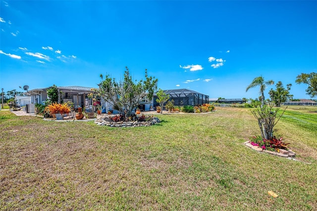 view of yard with a lanai