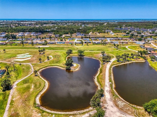birds eye view of property with a residential view and a water view