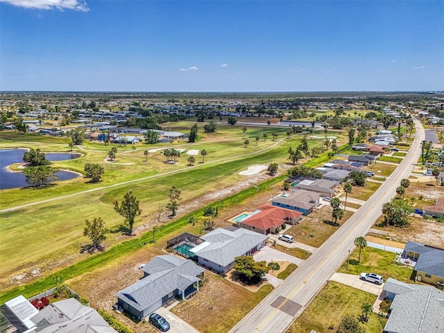 bird's eye view with a water view, golf course view, and a residential view