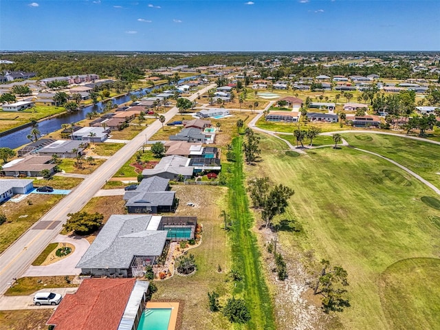 bird's eye view with a water view and a residential view
