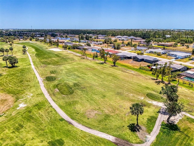 birds eye view of property with a residential view and view of golf course