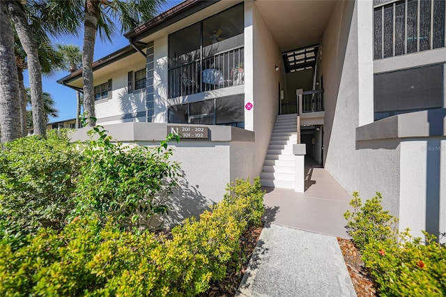 doorway to property with stucco siding