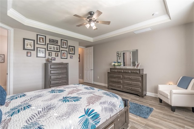 6763 Winding Cypress Dr, Naples, FL 34114 - bedroom featuring ornamental molding, baseboards, ceiling fan, light wood-type flooring, and a raised ceiling