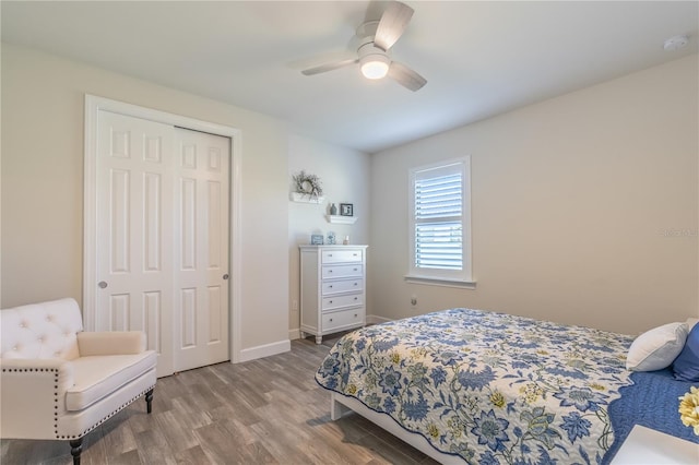 6763 Winding Cypress Dr, Naples, FL 34114 - bedroom featuring baseboards, ceiling fan, a closet, and wood finished floors