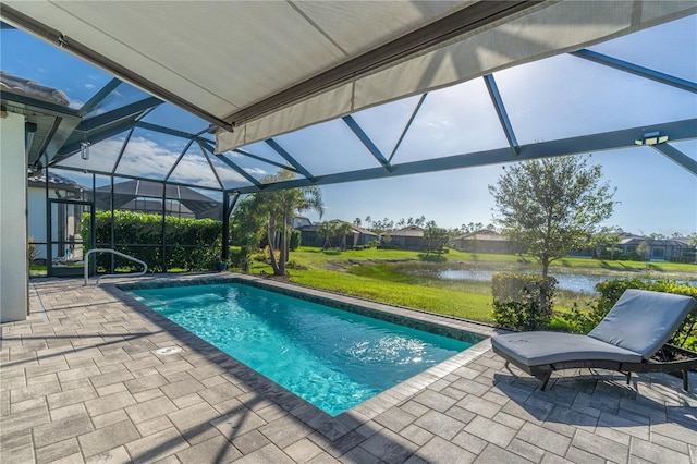 6763 Winding Cypress Dr, Naples, FL 34114 - outdoor pool featuring a patio, a water view, glass enclosure, and a yard