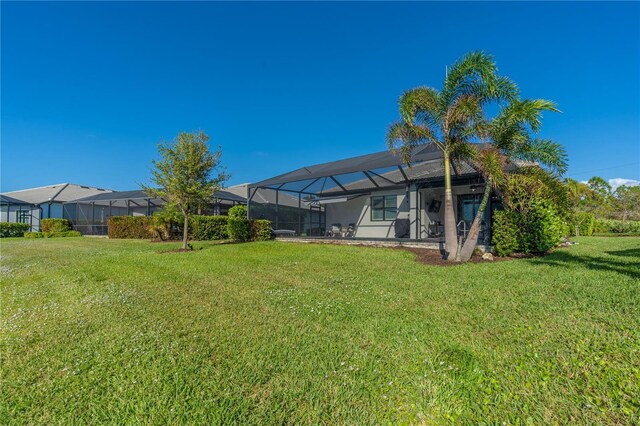 6763 Winding Cypress Dr, Naples, FL 34114 - view of yard featuring glass enclosure
