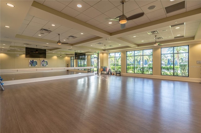 6763 Winding Cypress Dr, Naples, FL 34114 - exercise room with baseboards, a ceiling fan, wood finished floors, and visible vents