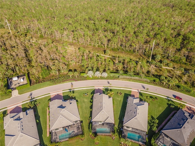 6763 Winding Cypress Dr, Naples, FL 34114 - birds eye view of property with a forest view