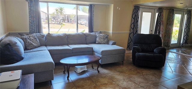 570 Mimosa Ave NW, Port Charlotte, FL 33952 - tiled living room featuring baseboards