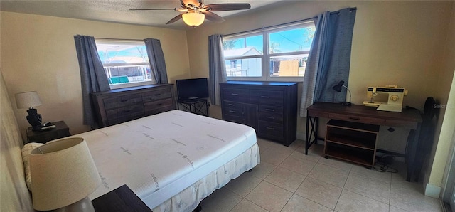 570 Mimosa Ave NW, Port Charlotte, FL 33952 - bedroom featuring light tile patterned floors and a ceiling fan