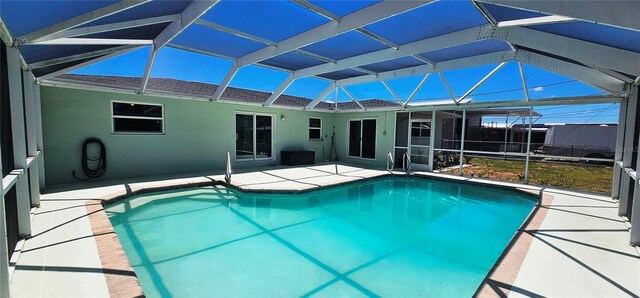 570 Mimosa Ave NW, Port Charlotte, FL 33952 - outdoor pool with a patio and glass enclosure