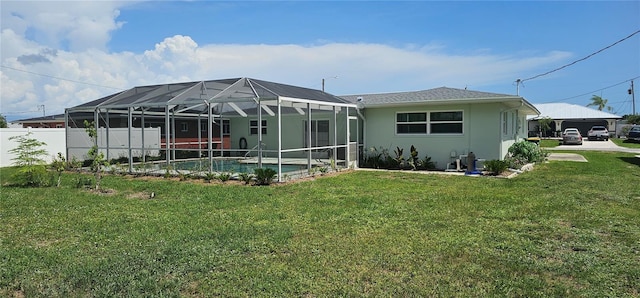 570 Mimosa Ave NW, Port Charlotte, FL 33952 - rear view of house featuring stucco siding and glass enclosure