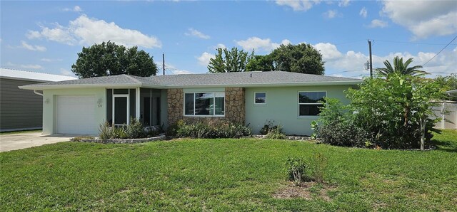 570 Mimosa Ave NW, Port Charlotte, FL 33952 - single story home with a garage, driveway, a front yard, stone siding, and stucco siding