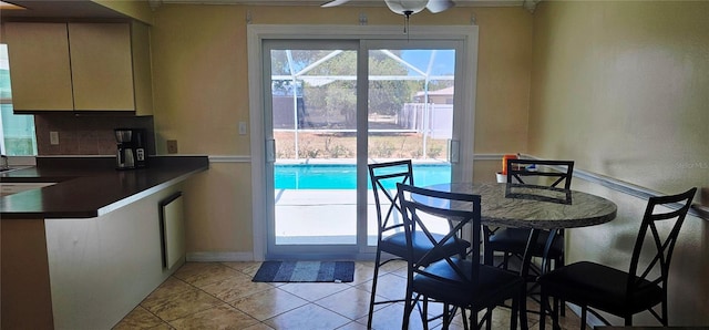 570 Mimosa Ave NW, Port Charlotte, FL 33952 - dining area featuring light tile patterned flooring and ceiling fan