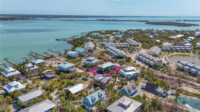 bird's eye view with a water view and a residential view