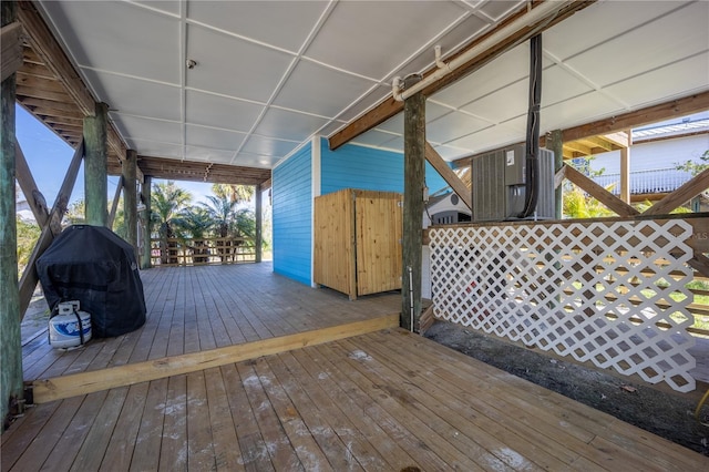 deck with cooling unit and grilling area