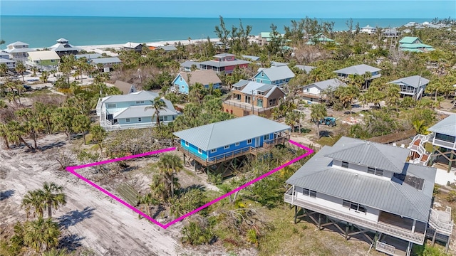 birds eye view of property with a water view and a residential view