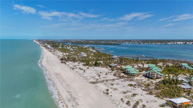 bird's eye view featuring a water view and a view of the beach