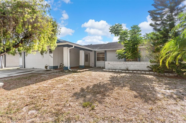 ranch-style home featuring an attached garage