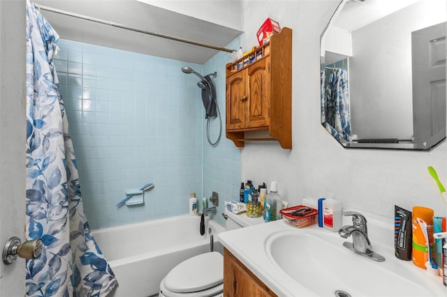 bathroom featuring shower / bath combo with shower curtain, toilet, and vanity