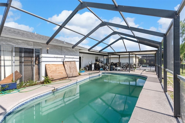 pool with a lanai and a patio