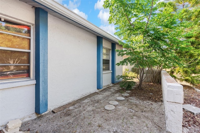 view of property exterior with stucco siding