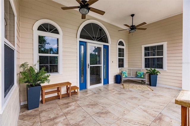 property entrance with a ceiling fan