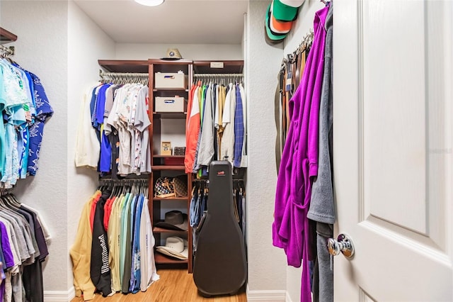spacious closet with wood finished floors