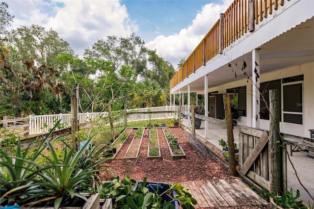 view of yard featuring a garden and fence