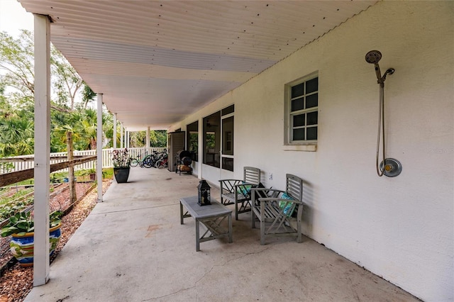view of patio / terrace featuring fence