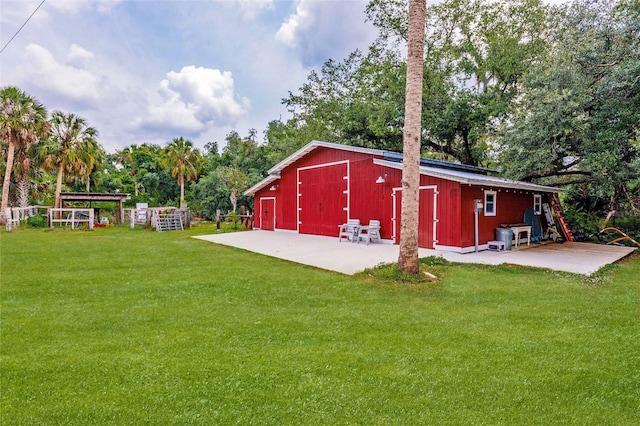 view of pole building with a lawn