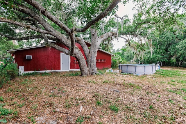 view of yard featuring an outdoor pool