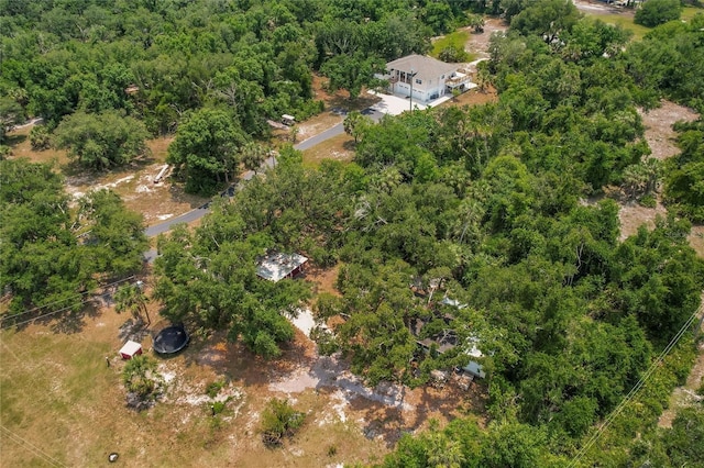 bird's eye view featuring a wooded view