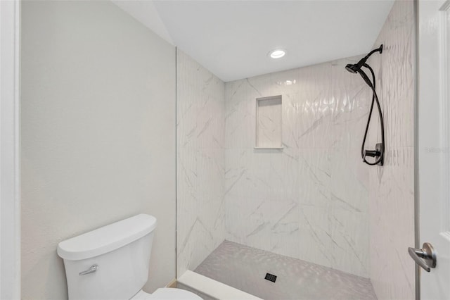 full bathroom featuring recessed lighting, a stall shower, and toilet