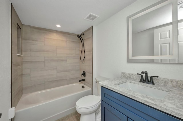 bathroom featuring vanity, toilet, recessed lighting, bathing tub / shower combination, and visible vents