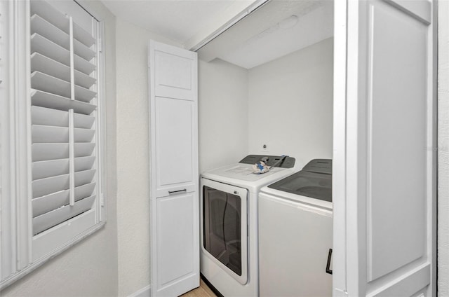 laundry room featuring laundry area and washer and clothes dryer