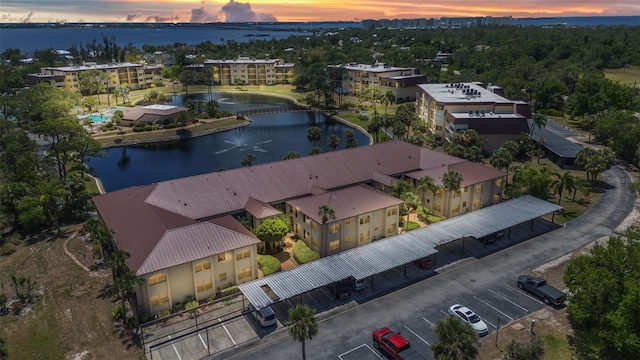 aerial view at dusk with a water view