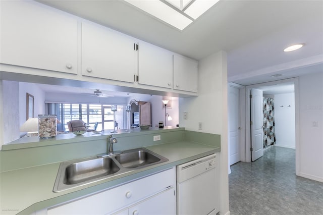 kitchen featuring light countertops, a ceiling fan, a sink, white cabinets, and dishwasher