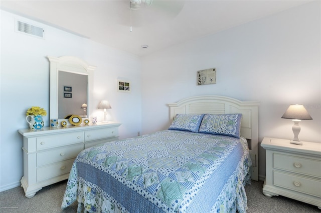 carpeted bedroom featuring baseboards and visible vents