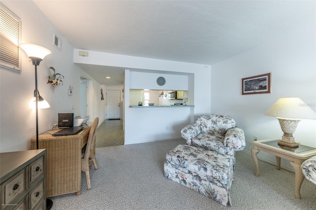 interior space with carpet flooring, baseboards, and visible vents