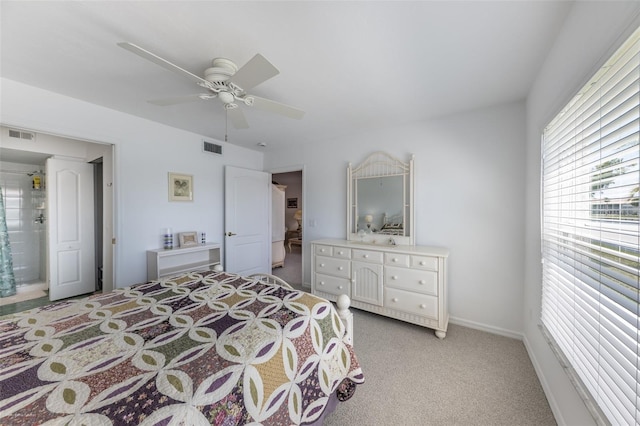 bedroom with ceiling fan, visible vents, and light colored carpet