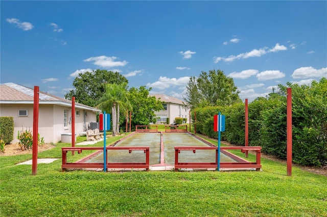 view of community with a lawn